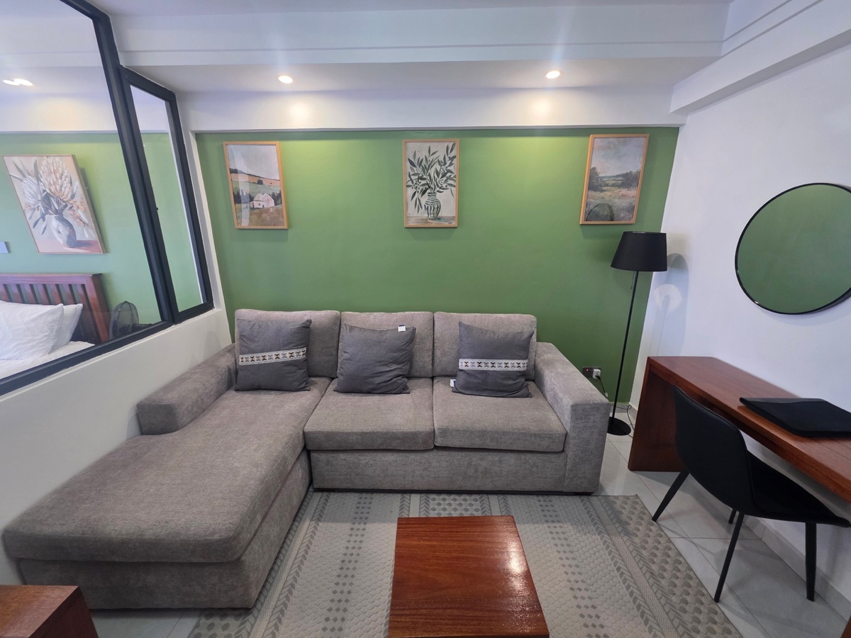 Living room with sofa and workspace