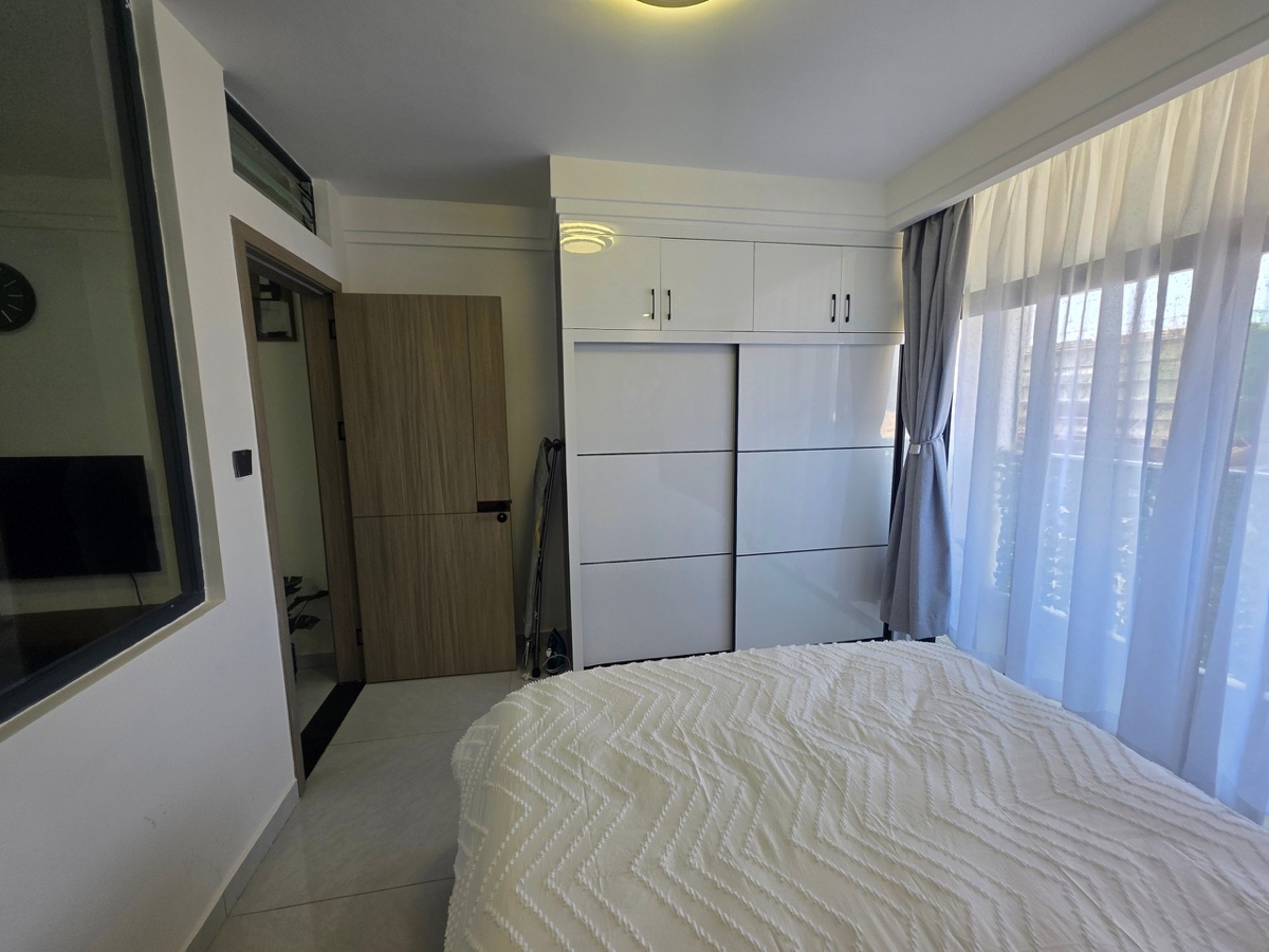 Bedroom with wardrobe and TV